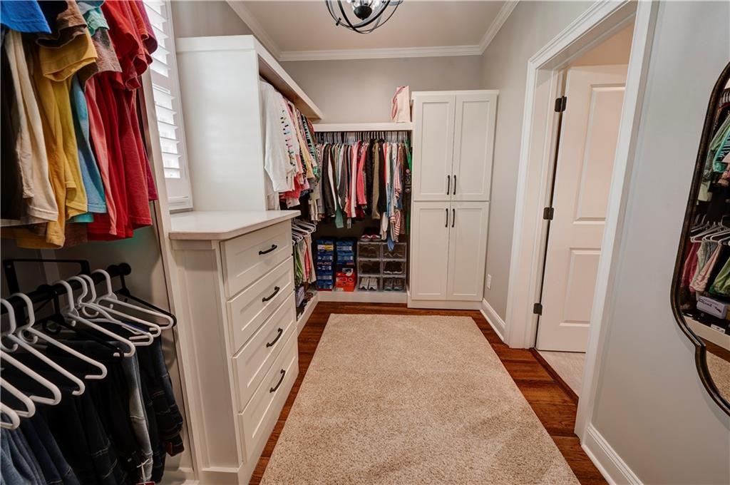2453 Boone Ford Road Southeast Calhoun, GA 30701 - Photo 74 of 135 a view of walk in closet with clothes and shoes