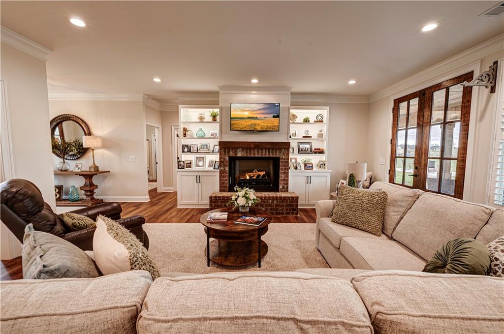 2453 Boone Ford Road Southeast Calhoun, GA 30701 - Photo 9 of 135 a living room with furniture fireplace and window