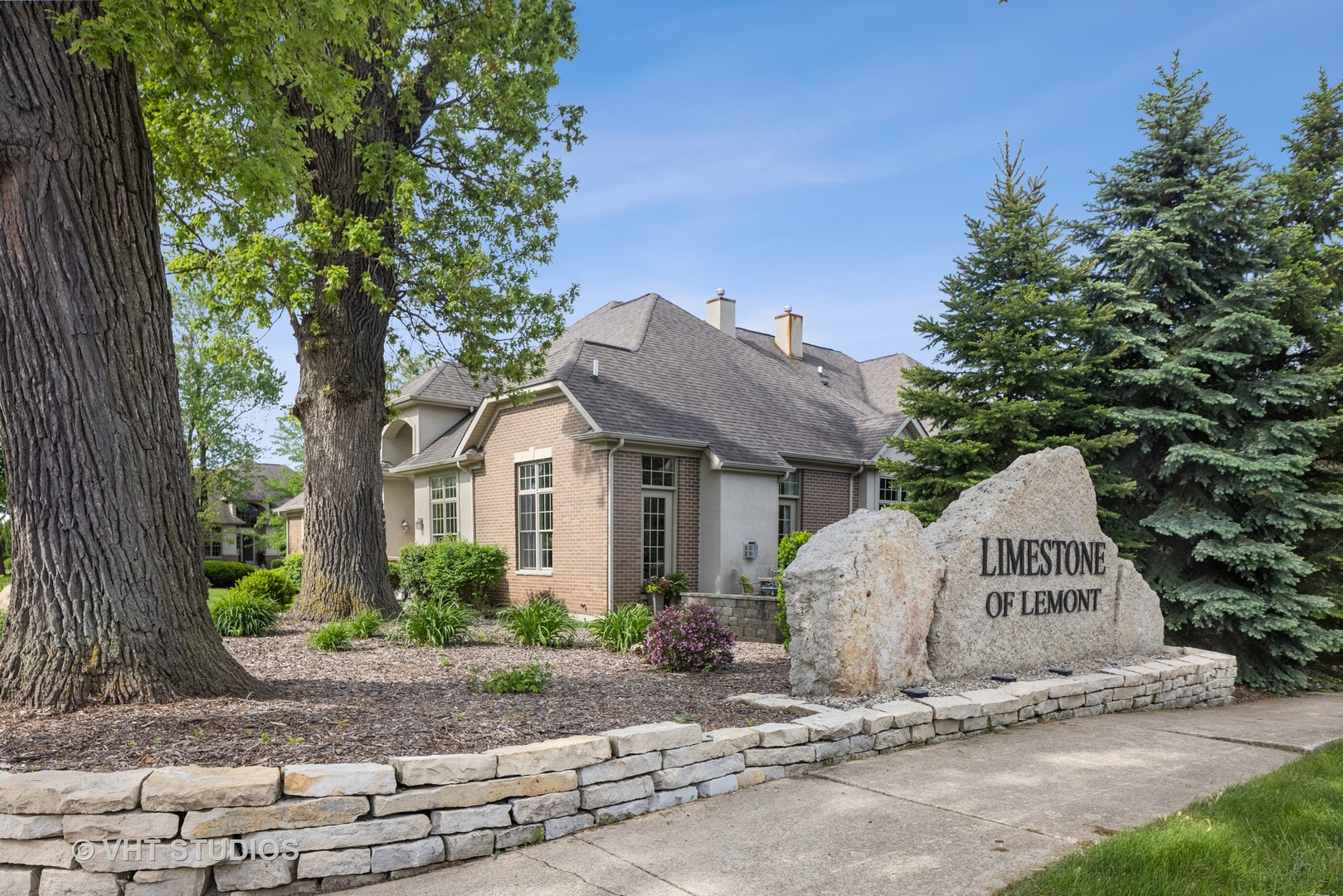 1001 Stacia Lane Lemont, IL 60439 - Photo 1 of 36 a view of a white house with a yard and large tree
