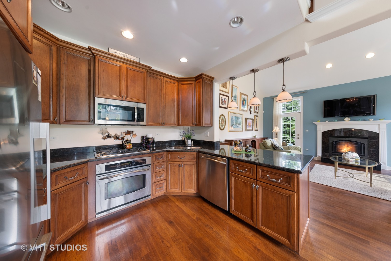 1001 Stacia Lane Lemont, IL 60439 - Photo 12 of 36 a kitchen with stainless steel appliances granite countertop a stove top oven a sink dishwasher a refrigerator and a microwave