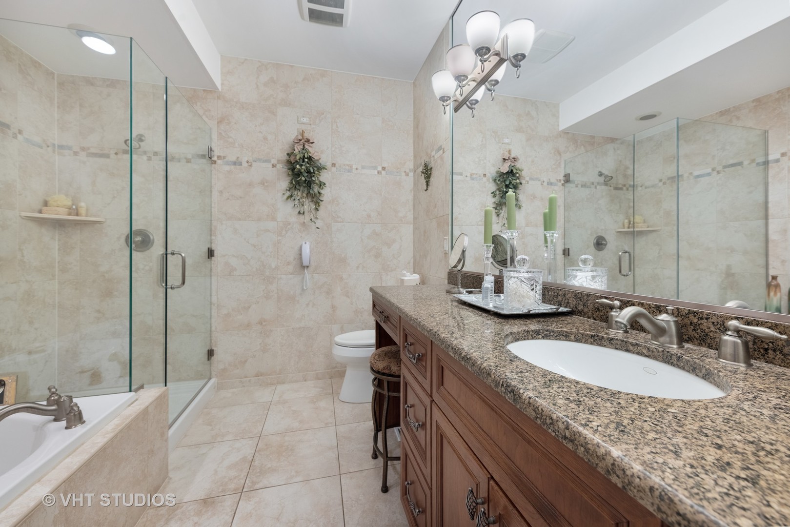 1001 Stacia Lane Lemont, IL 60439 - Photo 14 of 36 a bathroom with a granite countertop sink a toilet and shower