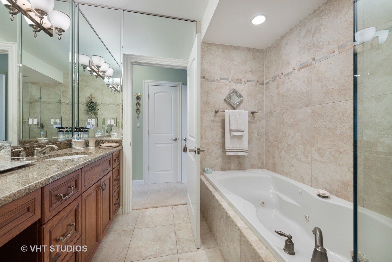 1001 Stacia Lane Lemont, IL 60439 - Photo 15 of 36 a bathroom with a granite countertop tub sink shower and mirror