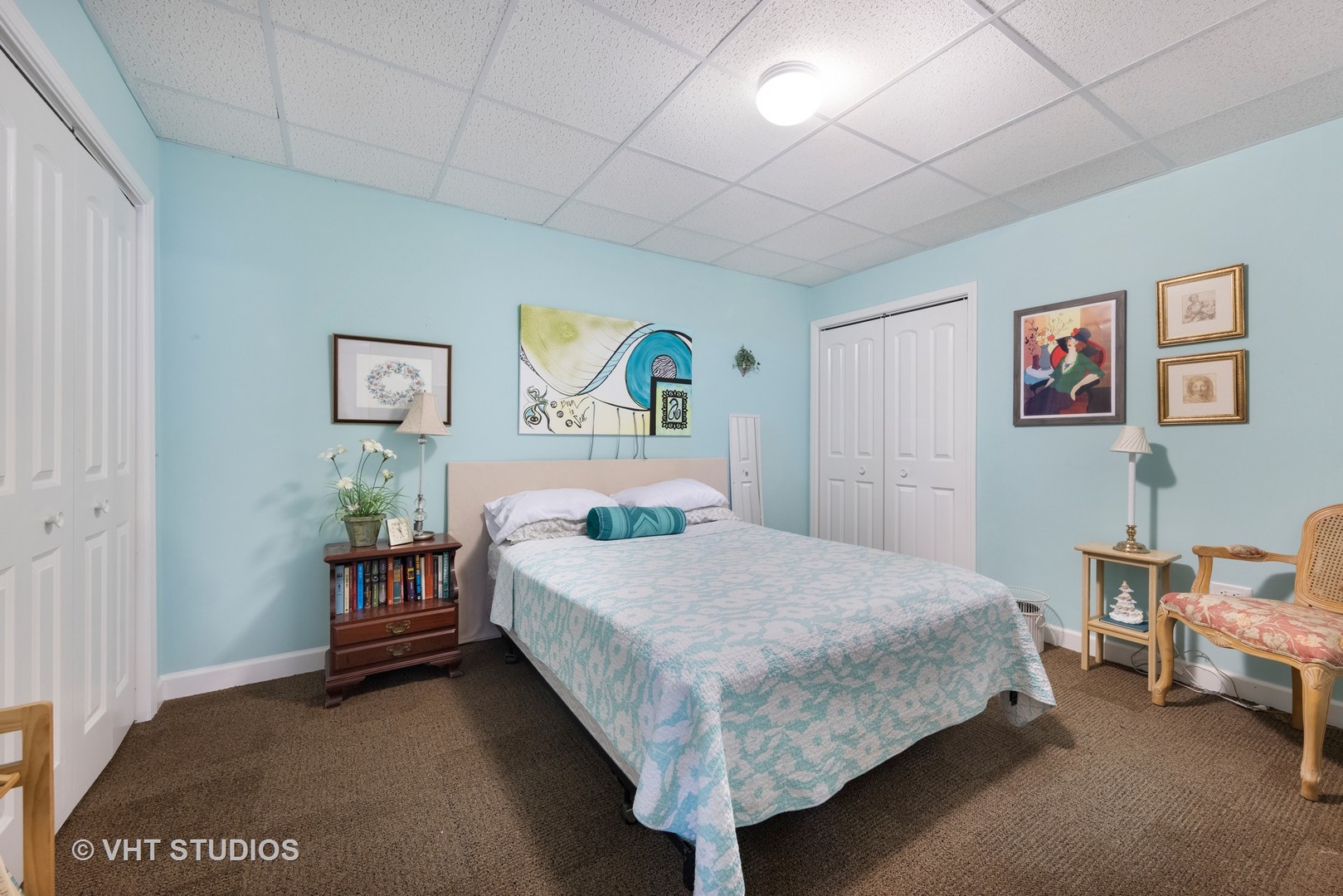 1001 Stacia Lane Lemont, IL 60439 - Photo 23 of 36 a bedroom with a bed and paintings on the wall