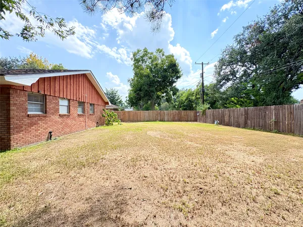 a swimming pool with wooden fence