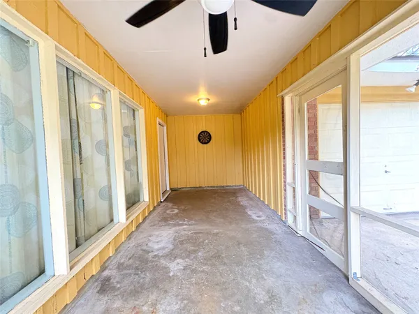 a view of a hallway with windows