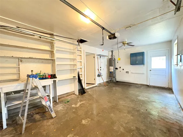 a view of a livingroom with furniture and a window