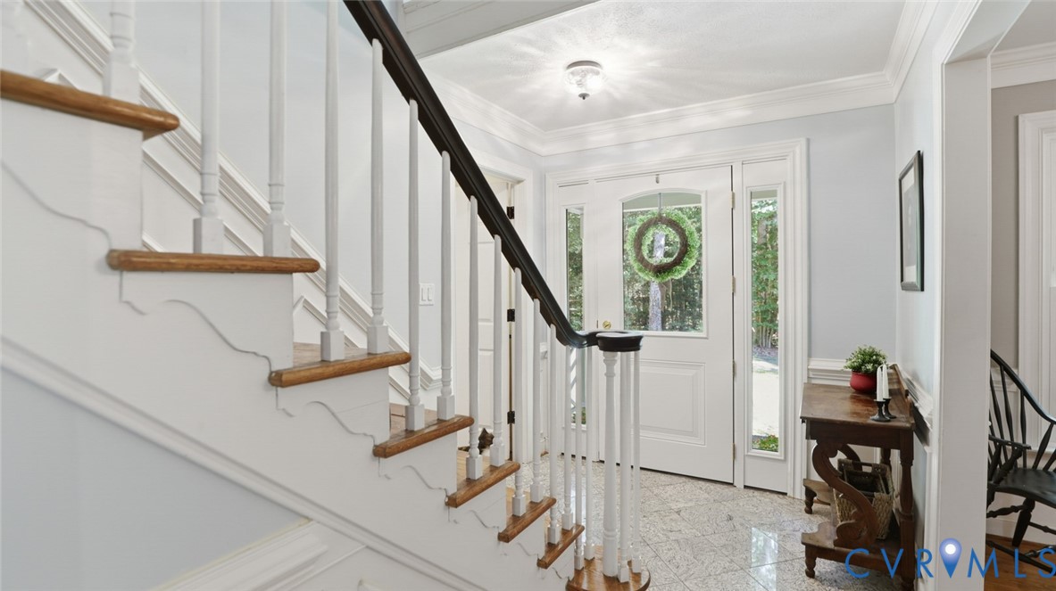 10716 Chalkley Road Richmond, VA 23237 - Photo 8 of 46 a view of an entryway with wooden floor and stairs