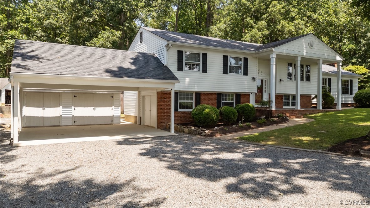 View of Double Size Carport with Garage Behind