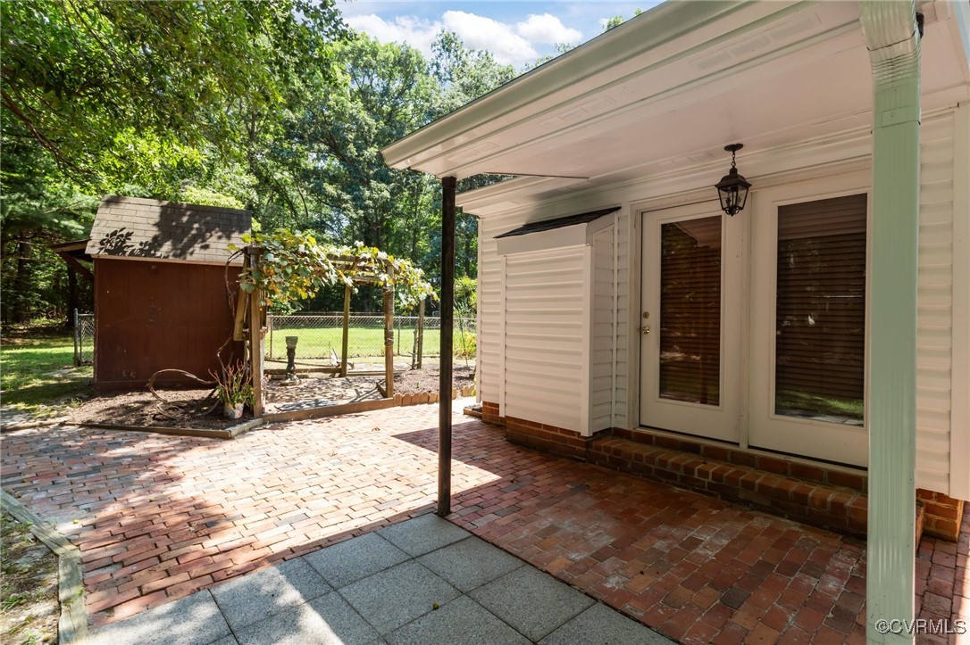 4116 Spring Run Road Mechanicsville, VA 23116 - Photo 37 of 45 View of patio featuring a storage shed and french