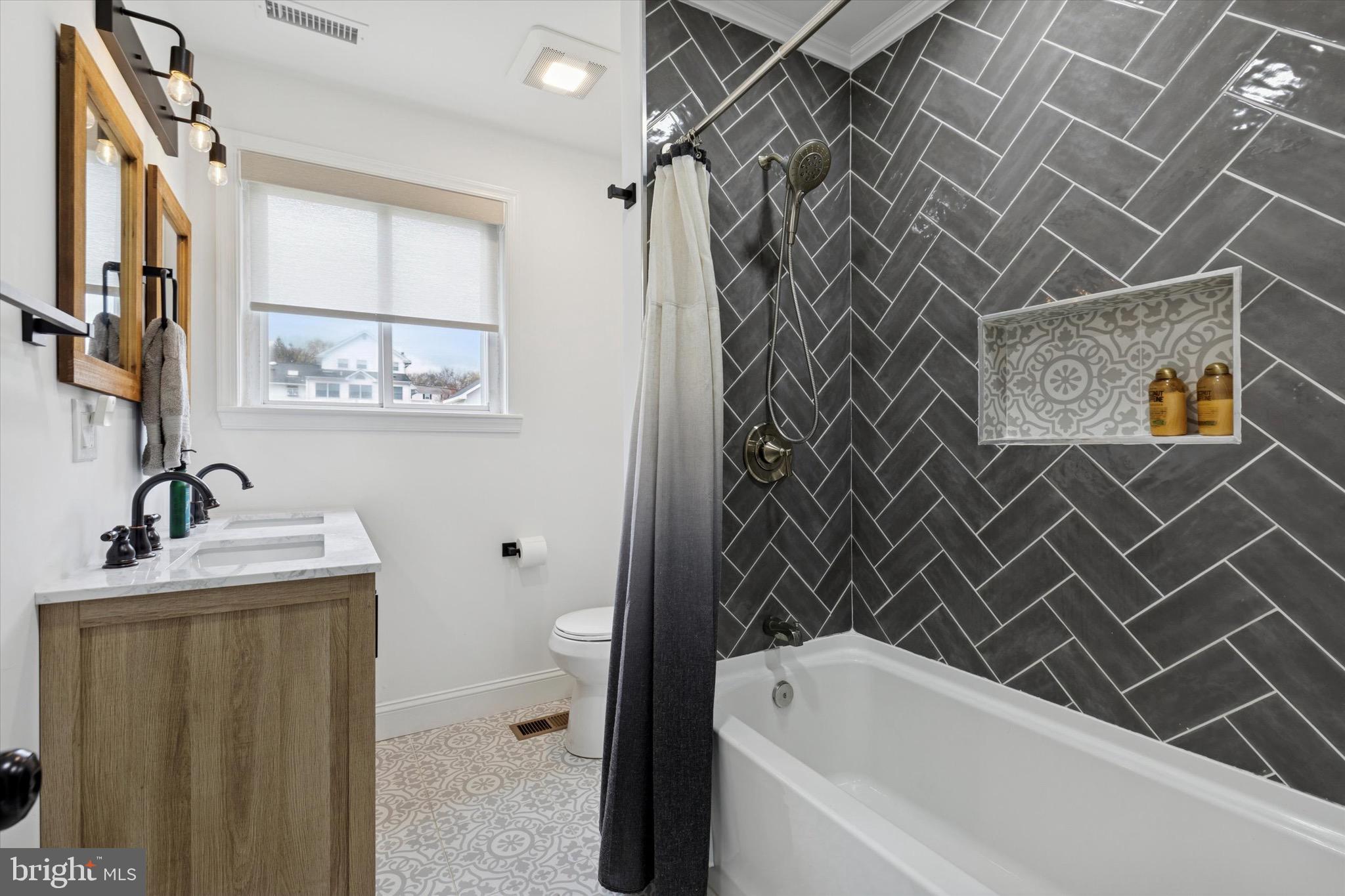 3023 Eisenhower Road Norristown, PA 19403 - Photo 13 of 22 a bathroom with a sink a toilet and shower
