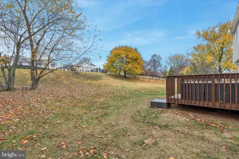 a view of a yard with a house in the background