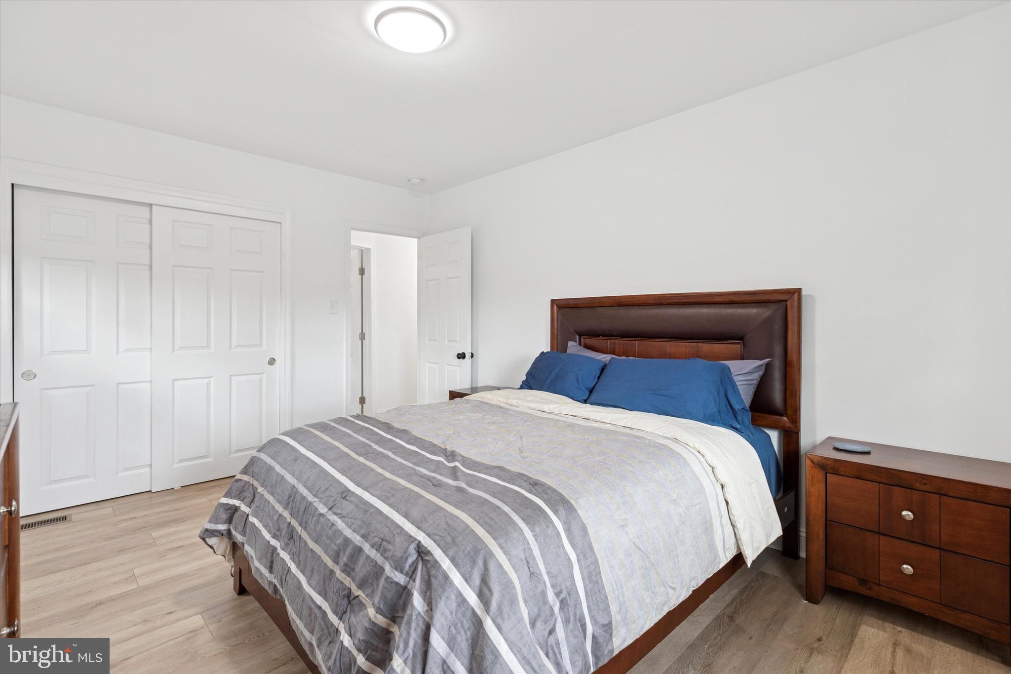 3023 Eisenhower Road Norristown, PA 19403 - Photo 10 of 22 a bedroom with a bed and a night stand