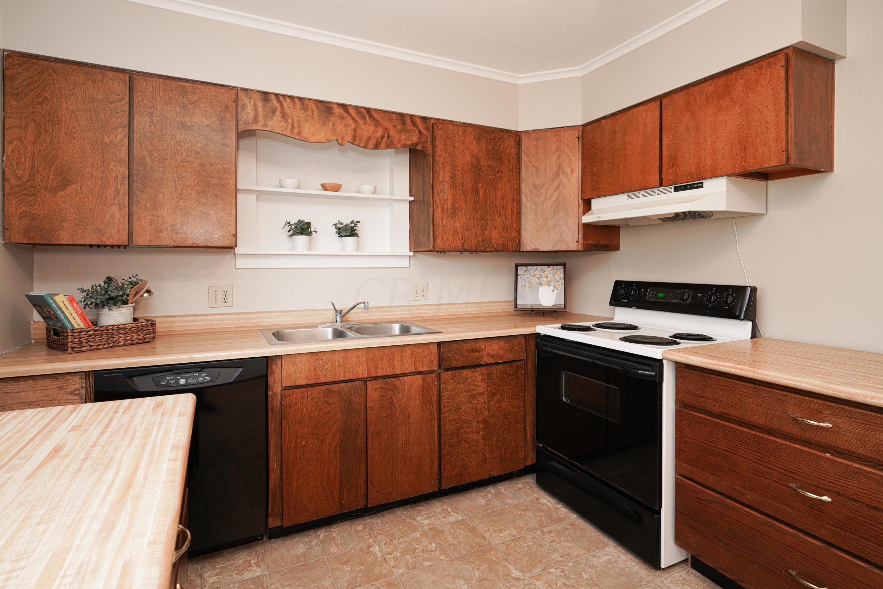 203 Troy Road Delaware, OH 43015 - Photo 14 of 37 Appliances remain in this kitchen with dining space.