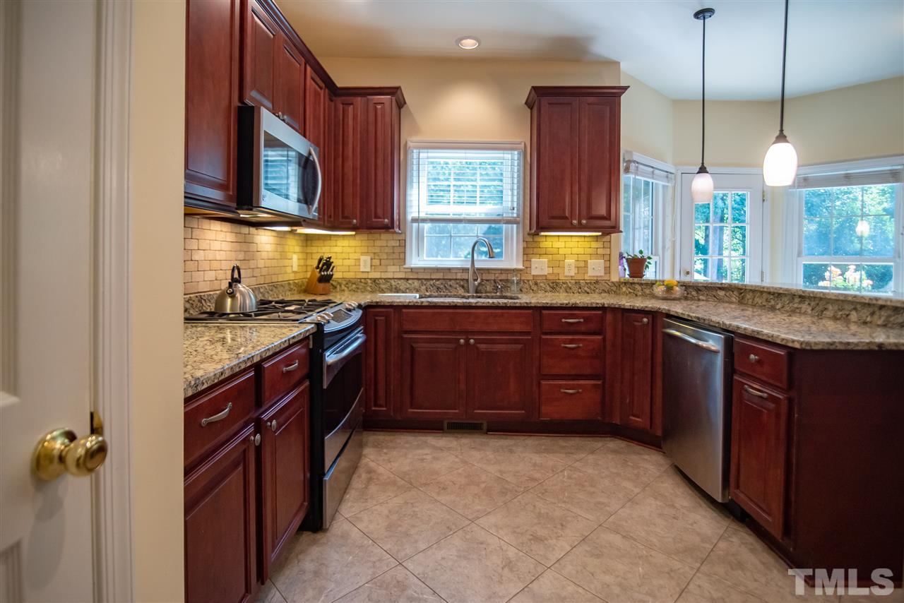 9716 Talman Court Raleigh, NC 27615 - Photo 12 of 30 Home chefs will love the stainless steel appliances and gas stove!