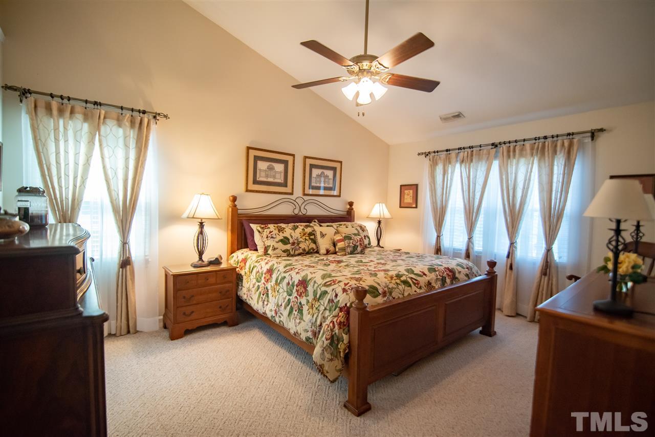 9716 Talman Court Raleigh, NC 27615 - Photo 19 of 30 Retreat to this relaxing space featuring cathedral ceilings and expansive windows.