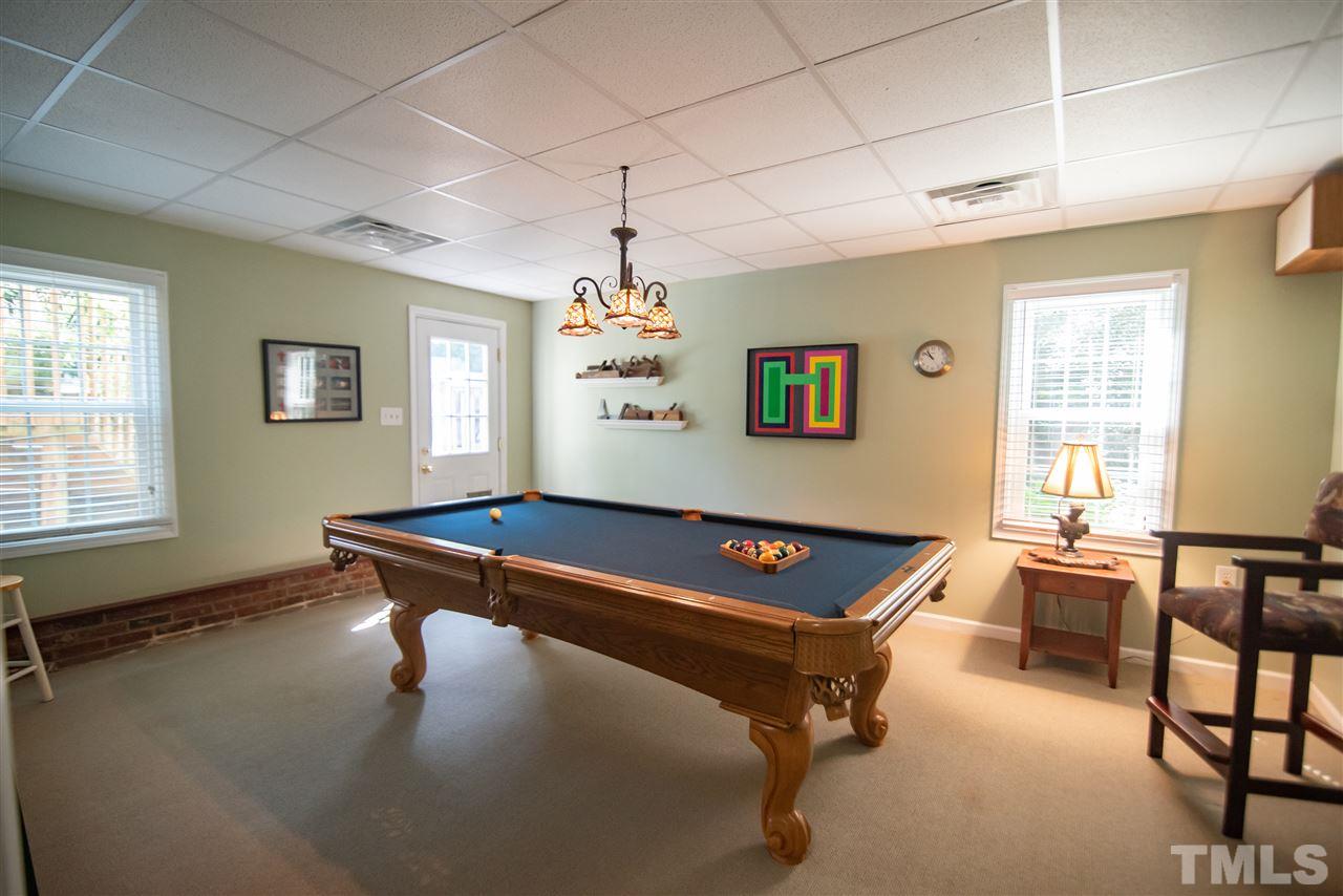 9716 Talman Court Raleigh, NC 27615 - Photo 25 of 30 Game night is a must. Pool table is included in the purchase.