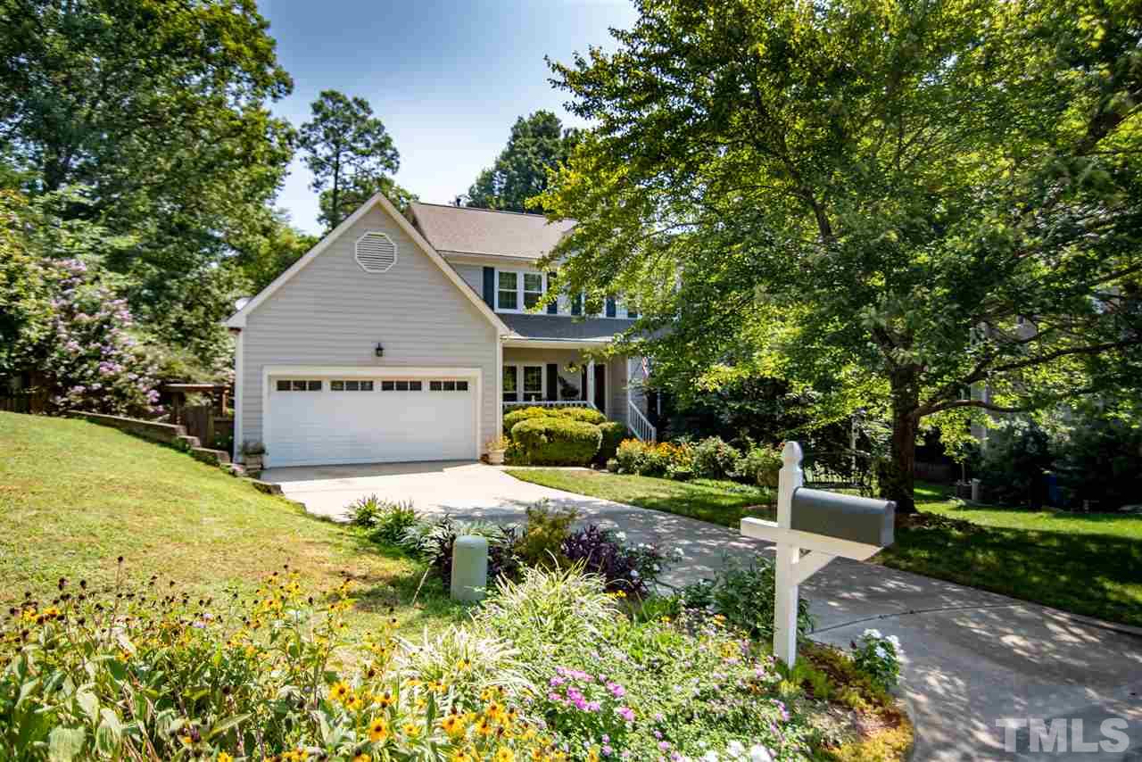 9716 Talman Court Raleigh, NC 27615 - Photo 4 of 30 Mature landscaping creates natural privacy.