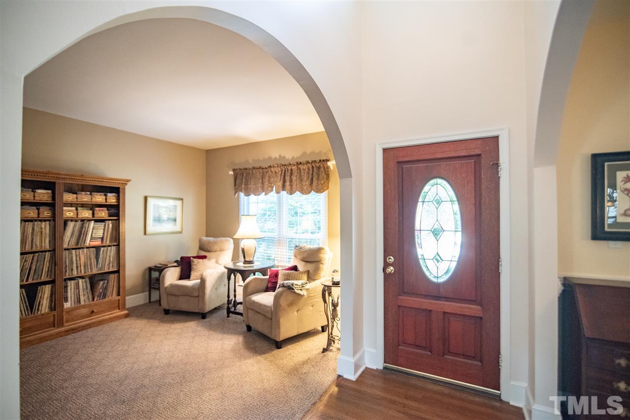 9716 Talman Court Raleigh, NC 27615 - Photo 6 of 30 Foyer features cathedral ceilings and arched entryways.