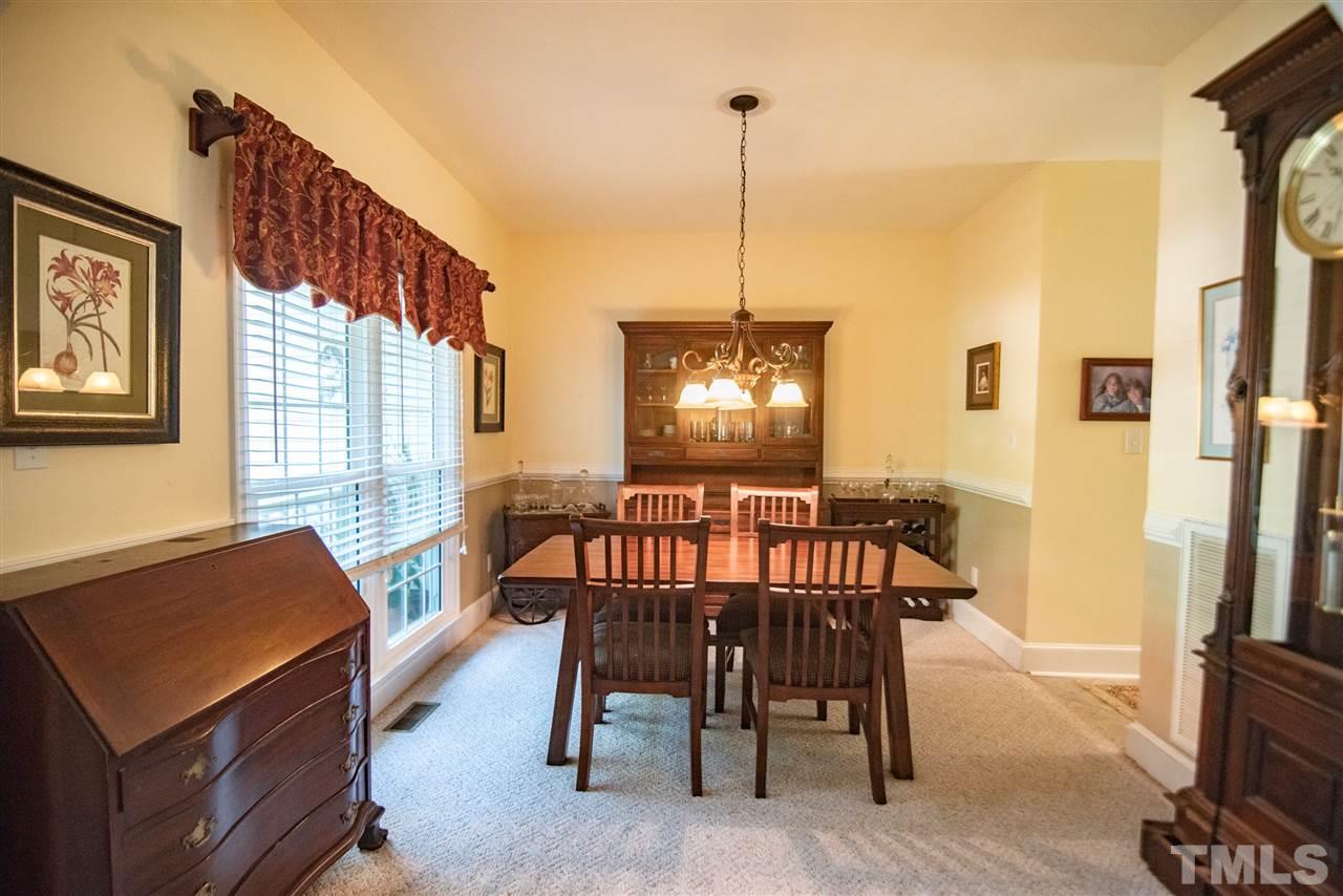 9716 Talman Court Raleigh, NC 27615 - Photo 7 of 30 Enjoy the company of family and friends around your dining room table!