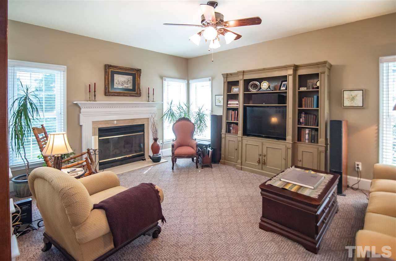 9716 Talman Court Raleigh, NC 27615 - Photo 10 of 30 Cozy up to the gas fireplace featuring remote control!