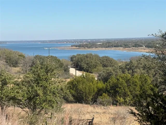 a backyard of a house with a yard and outdoor seating