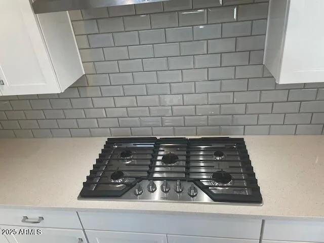 a close view of a stove a microwave and door