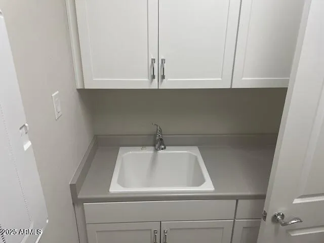 a close view of sink and cabinets