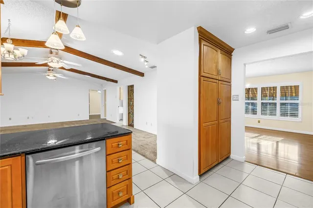 a kitchen that has a cabinets and a stove