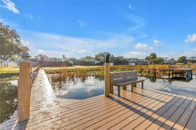 a view of a lake with outdoor seating