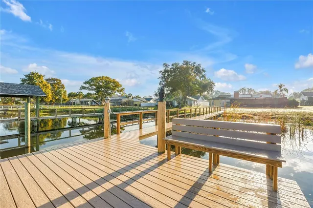a view of a balcony with wooden floor and city view
