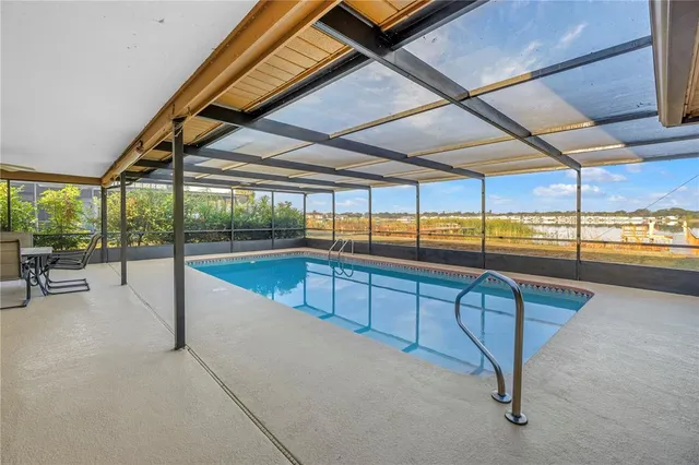a view of a swimming pool with a porch