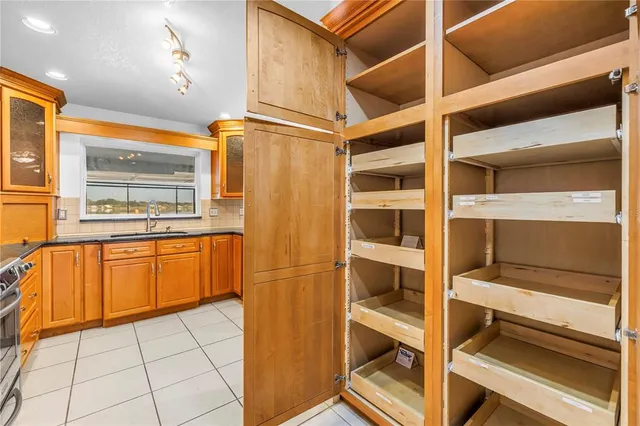 a kitchen with a refrigerator and cabinets