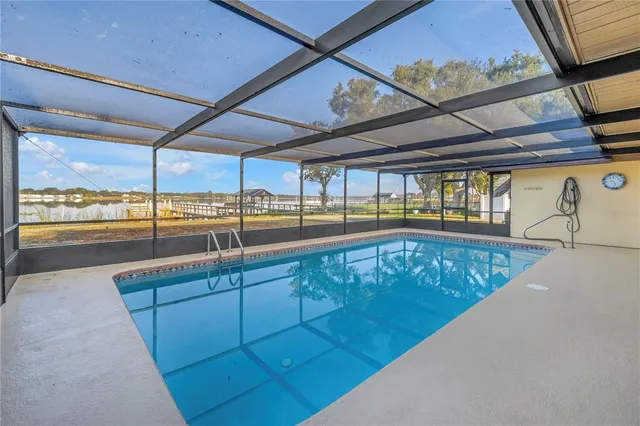 a view of a swimming pool with a chairs