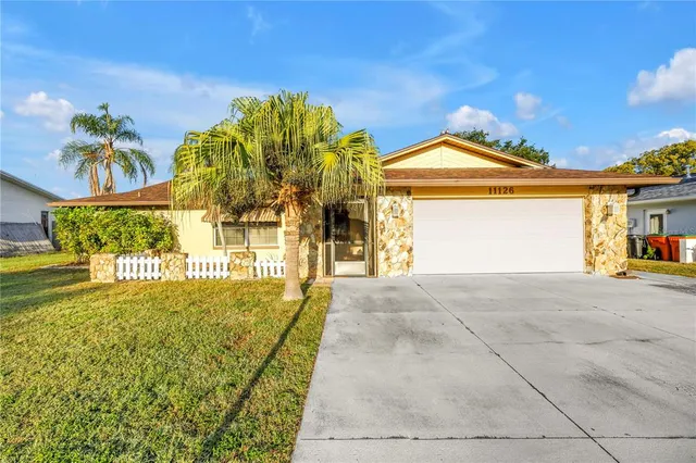 a view of a large house with a yard
