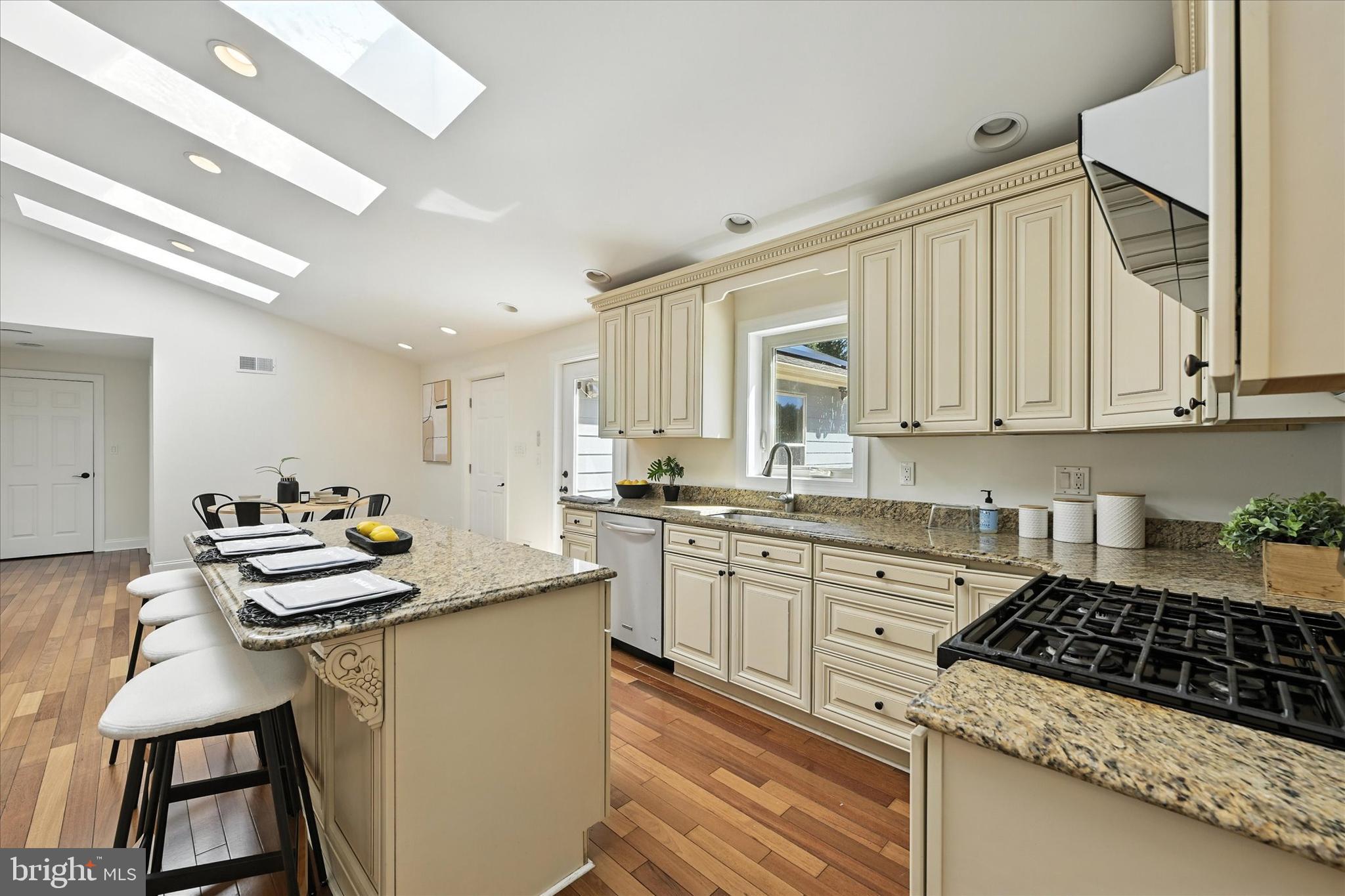 12325 Falls Road Cockeysville, MD 21030 - Photo 14 of 40 a kitchen with white cabinets and appliances
