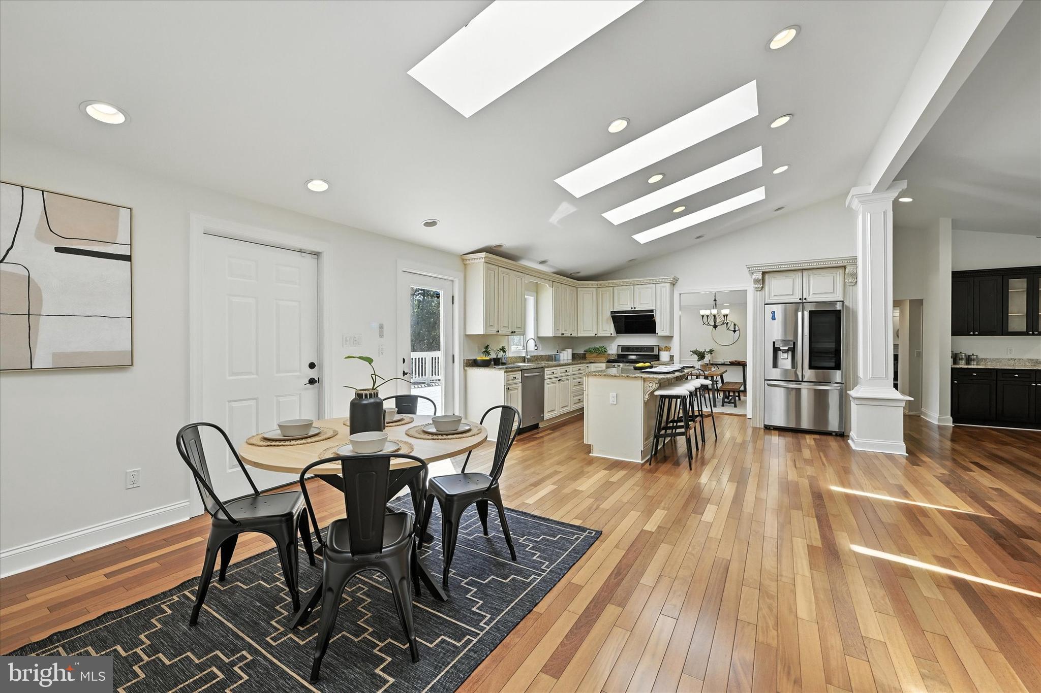 12325 Falls Road Cockeysville, MD 21030 - Photo 15 of 40 a view of a dining room with furniture and wooden floor