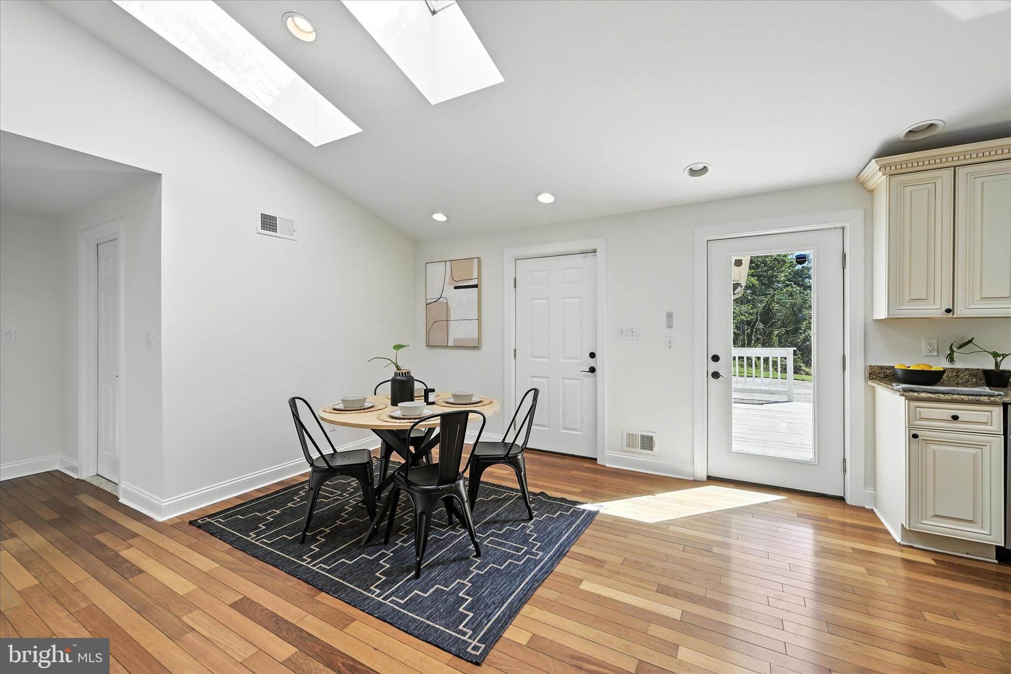 12325 Falls Road Cockeysville, MD 21030 - Photo 16 of 40 a view of a dining room with furniture and wooden floor