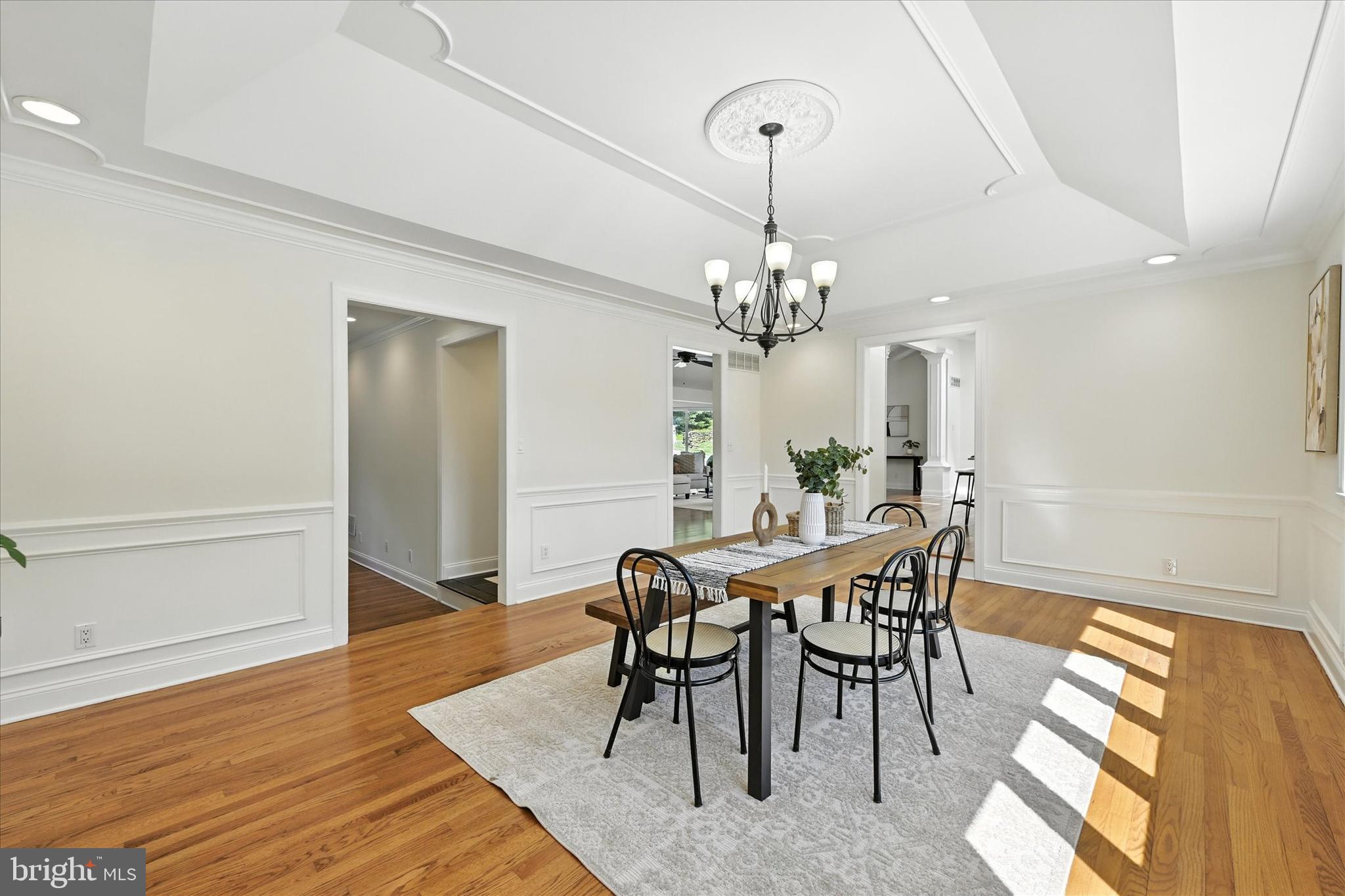 12325 Falls Road Cockeysville, MD 21030 - Photo 19 of 40 a view of a dining room with furniture and wooden floor
