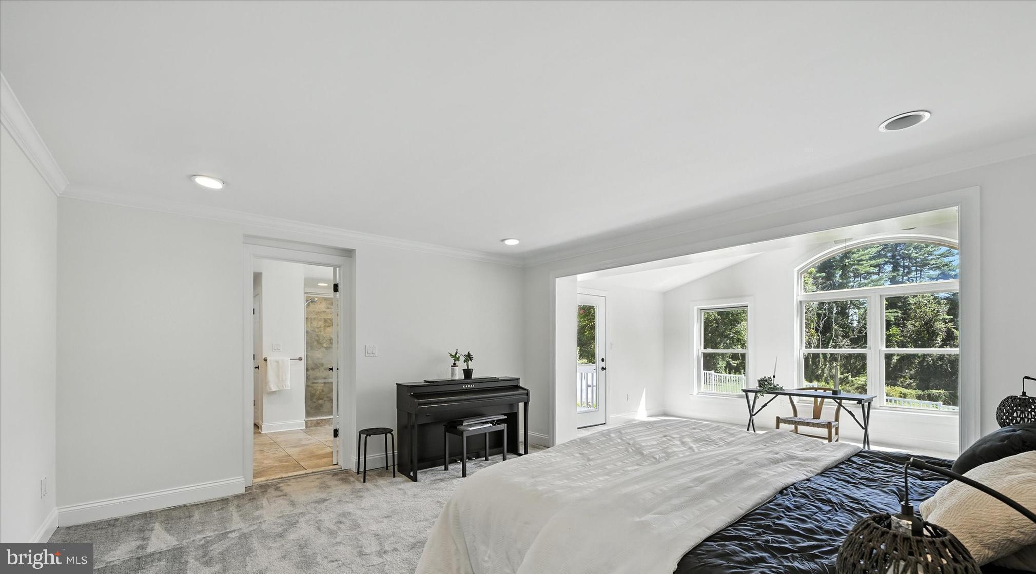 12325 Falls Road Cockeysville, MD 21030 - Photo 22 of 40 a spacious bedroom with a bed and a tv