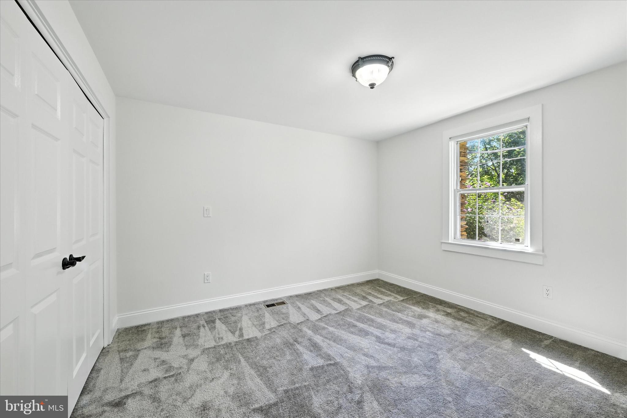 12325 Falls Road Cockeysville, MD 21030 - Photo 26 of 40 a view of an empty room with a window
