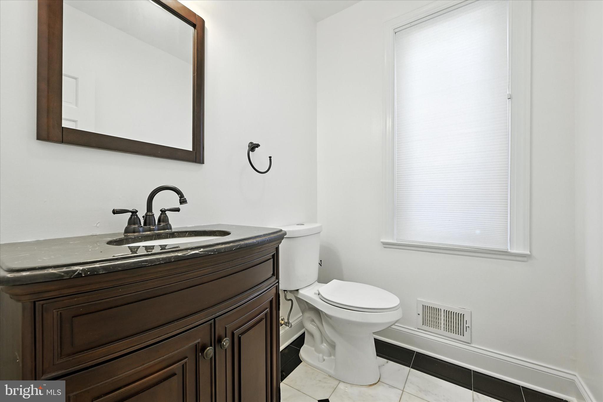 12325 Falls Road Cockeysville, MD 21030 - Photo 27 of 40 a bathroom with a sink and a toilet