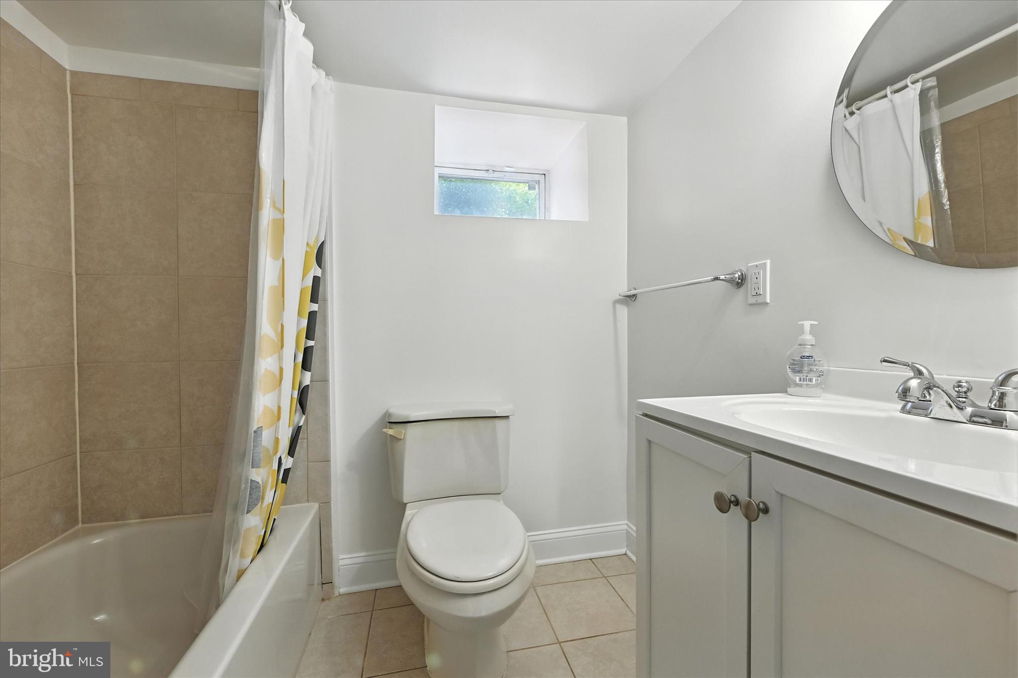 12325 Falls Road Cockeysville, MD 21030 - Photo 32 of 40 a bathroom with a sink toilet and shower