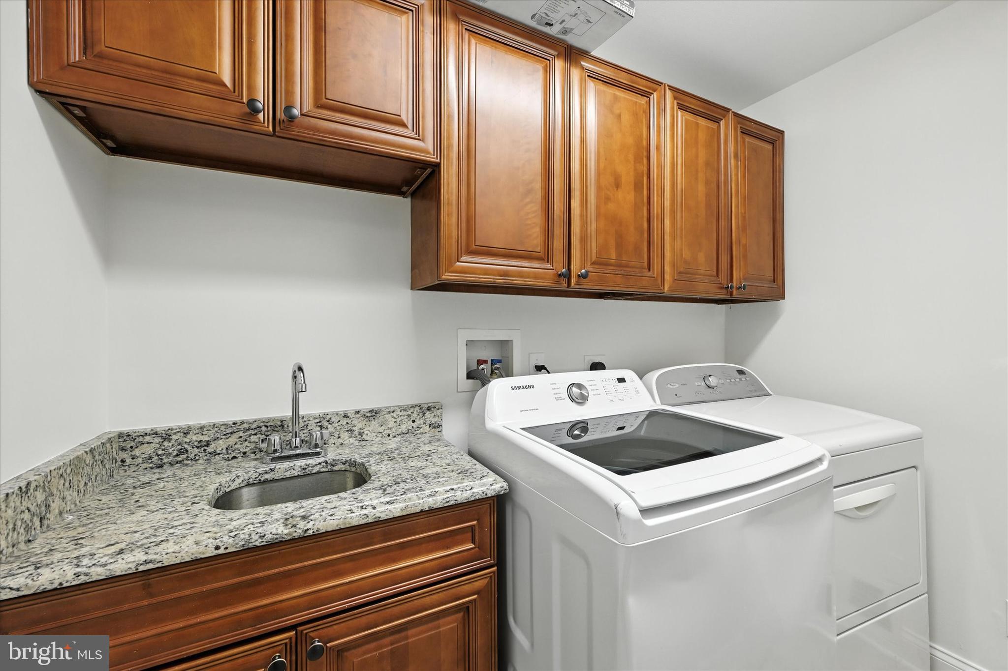 12325 Falls Road Cockeysville, MD 21030 - Photo 33 of 40 a bathroom with a sink and cabinets