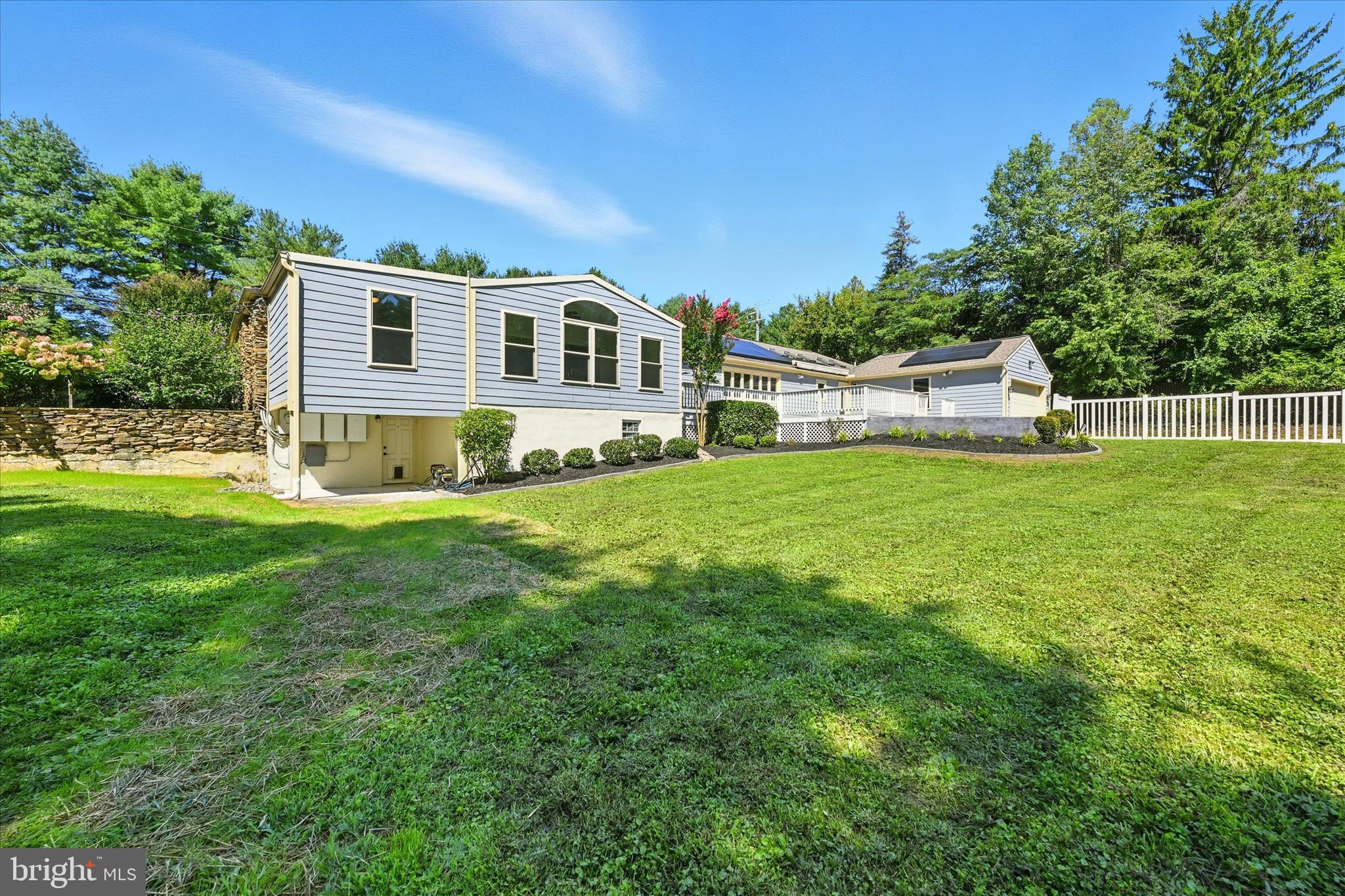 12325 Falls Road Cockeysville, MD 21030 - Photo 35 of 40 a house view with a sitting space and garden
