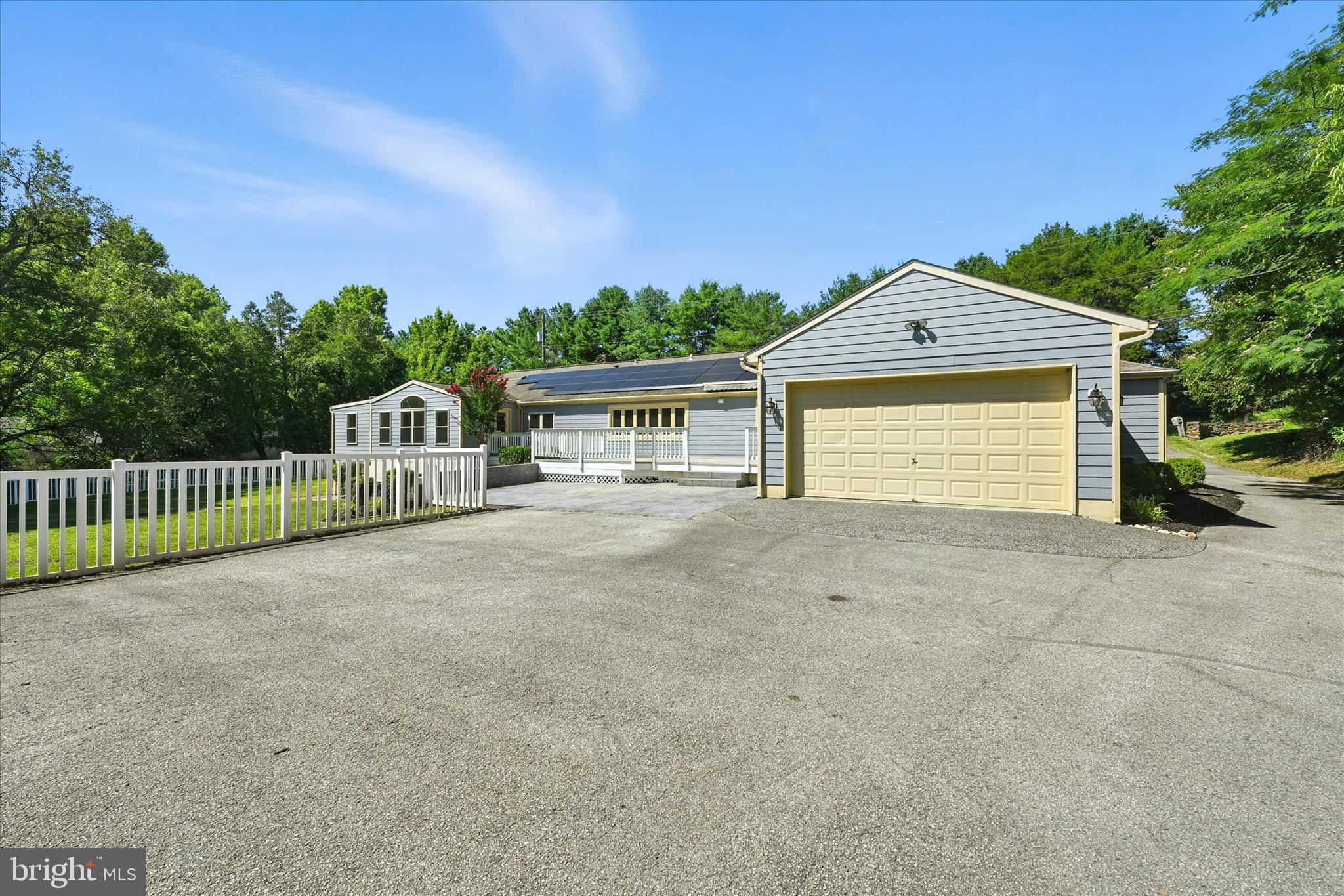 12325 Falls Road Cockeysville, MD 21030 - Photo 39 of 40 a view of a house with a yard and garage