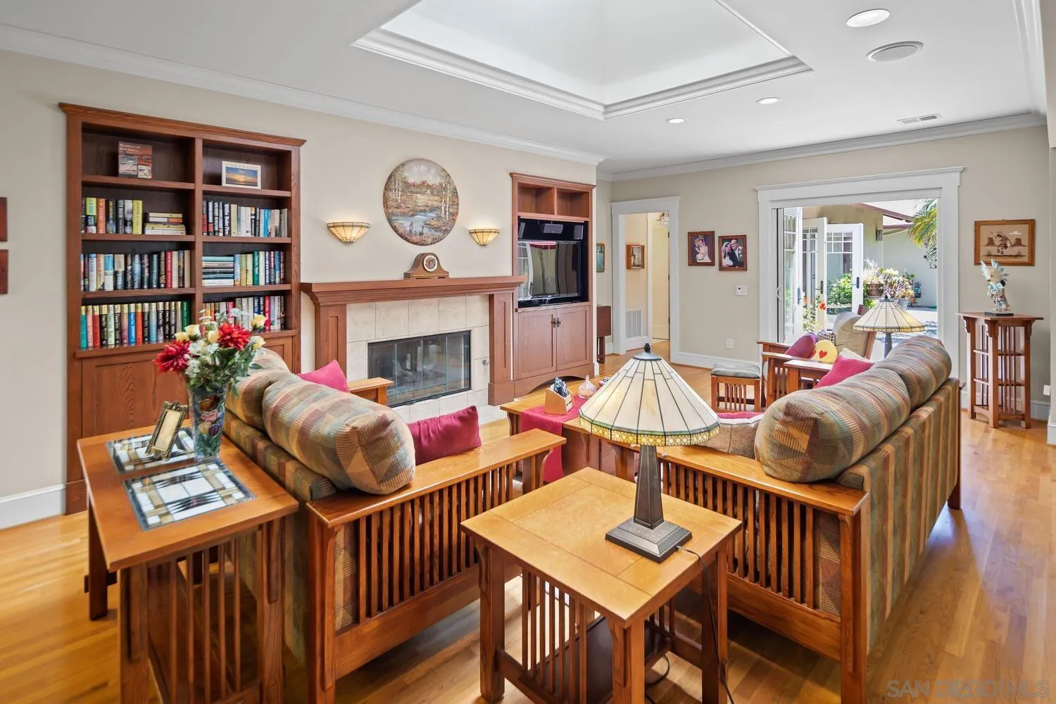 911 B Avenue Coronado, CA 92118 - Photo 11 of 45 a living room with furniture a rug and a bookshelf