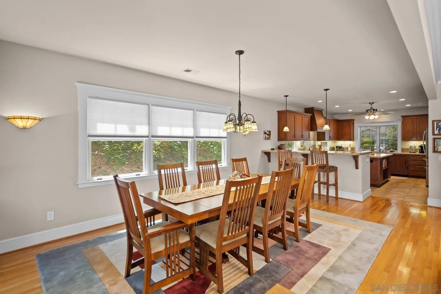 911 B Avenue Coronado, CA 92118 - Photo 13 of 45 a view of a dining room with furniture window and wooden floor