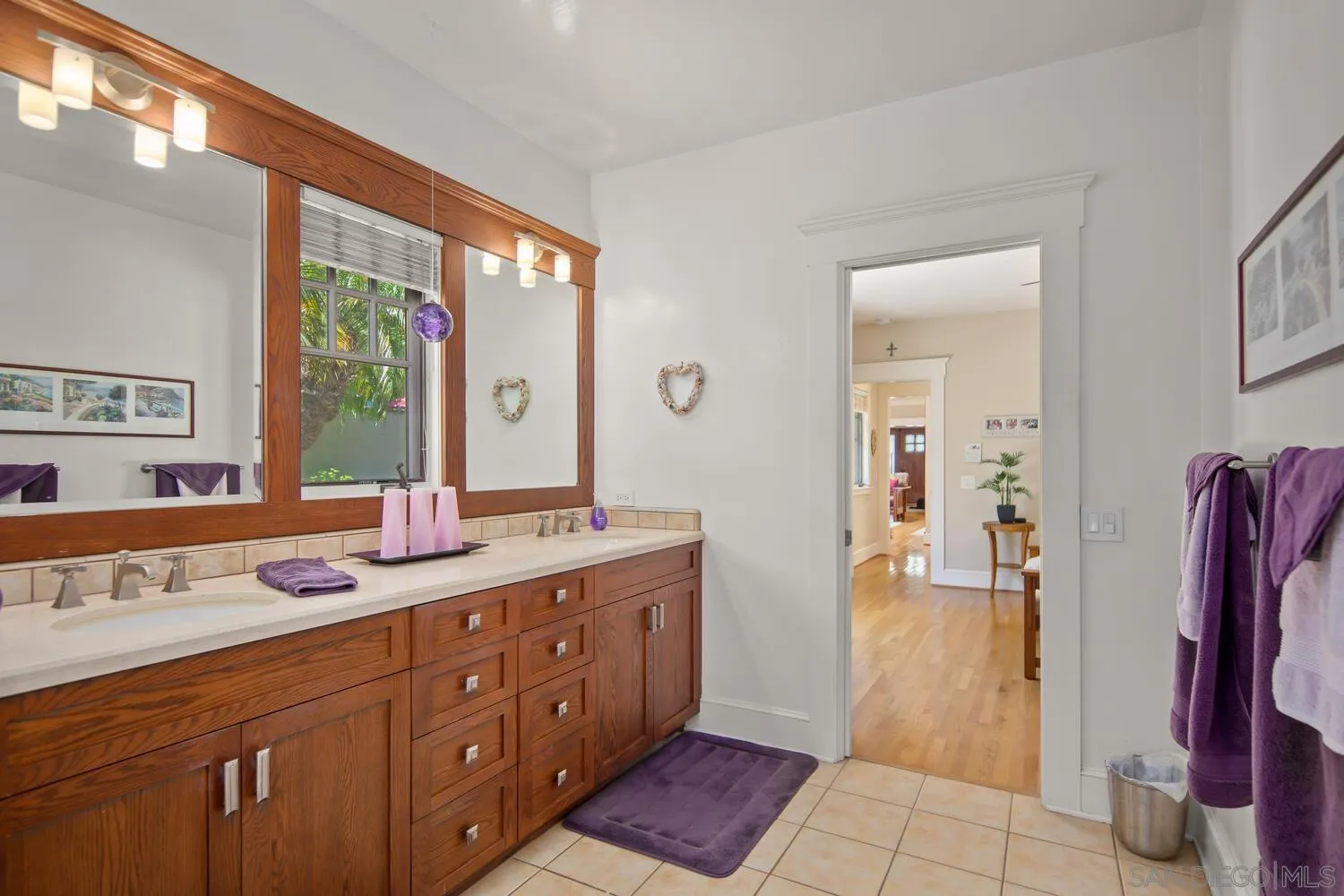 911 B Avenue Coronado, CA 92118 - Photo 23 of 45 a spacious bathroom with a double vanity sink and a mirror