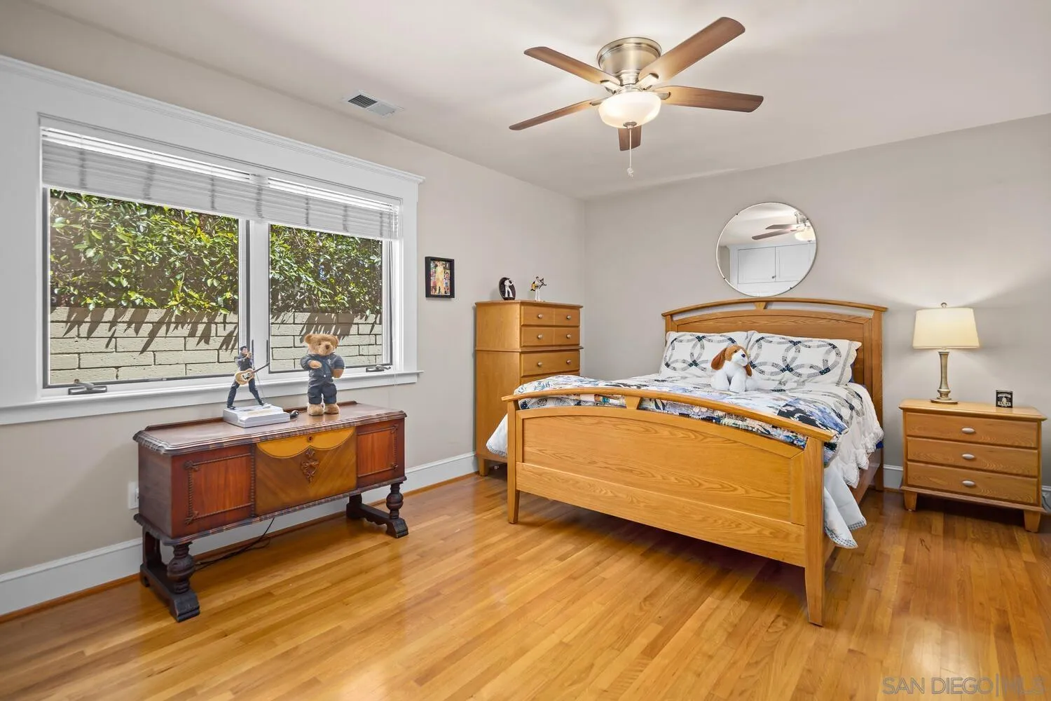 911 B Avenue Coronado, CA 92118 - Photo 25 of 45 a bedroom with a bed and wooden floor