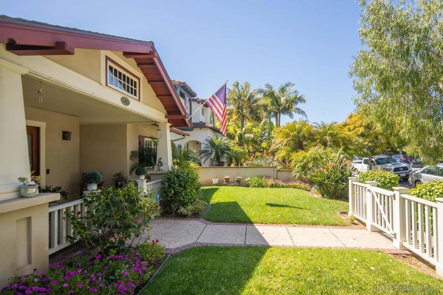 911 B Avenue Coronado, CA 92118 - Photo 3 of 45 a view of a house with a small yard and flower plants